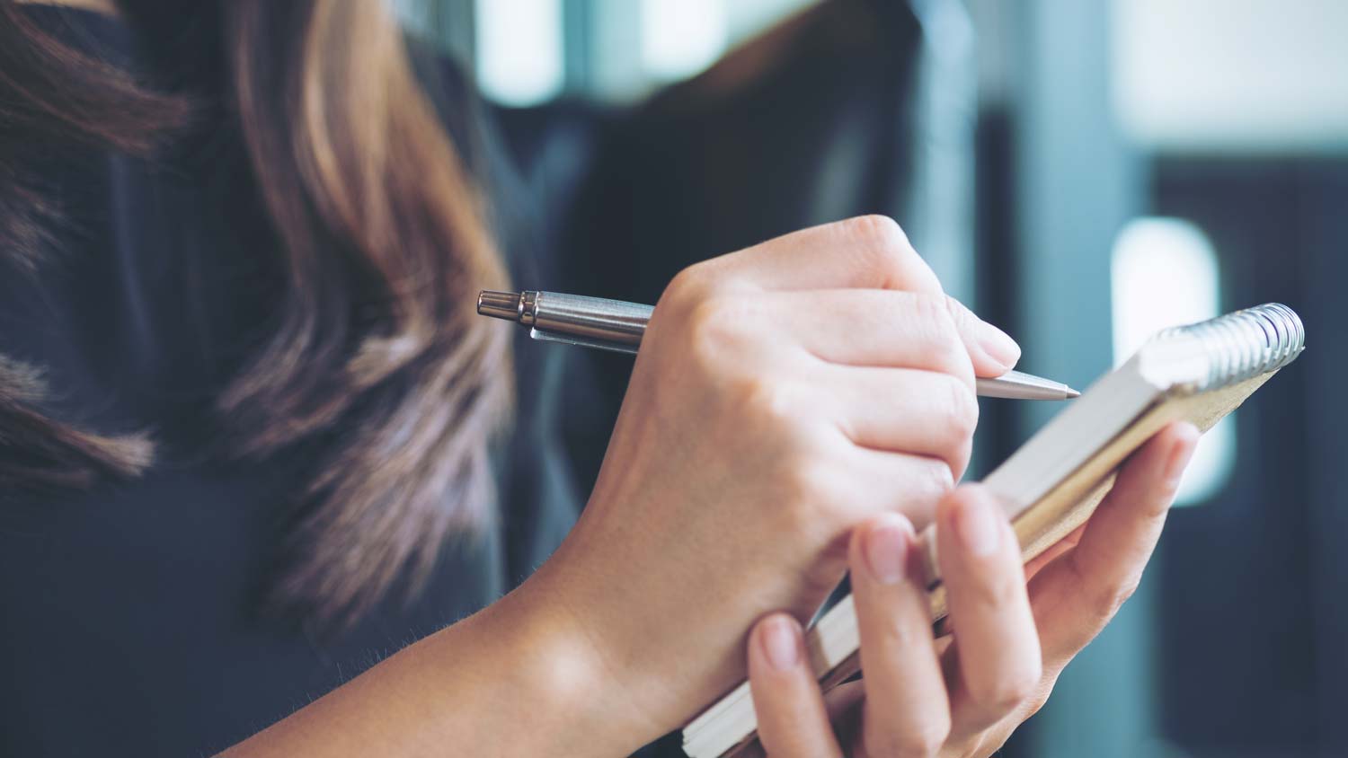 Woman taking notes