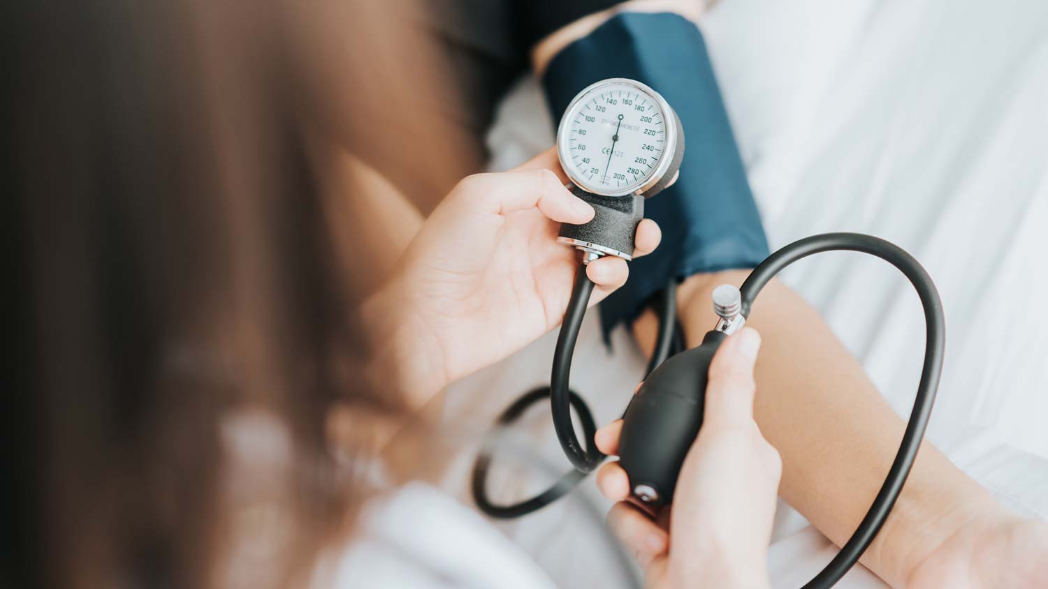 Woman checking blood pressure