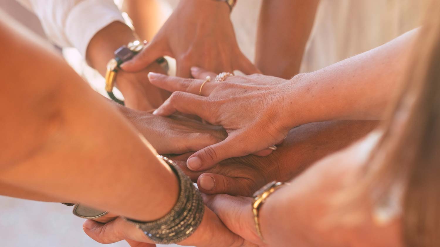 Group putting hands together