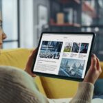 Woman on tablet looking at news website