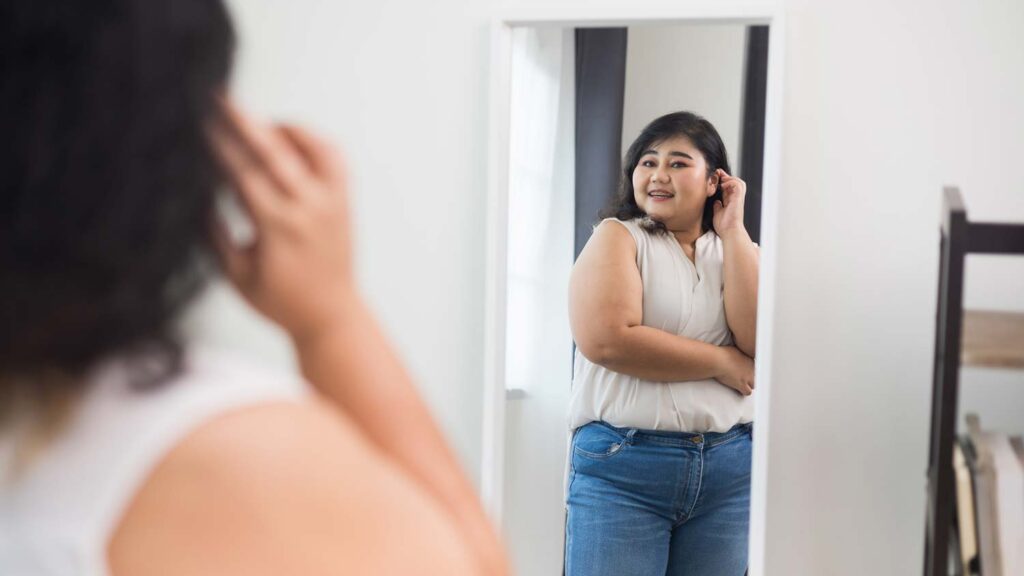 Woman looking confident in mirror