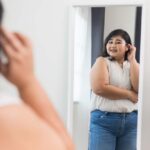 Woman looking confident in mirror