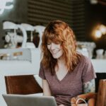 woman on laptop in cafe
