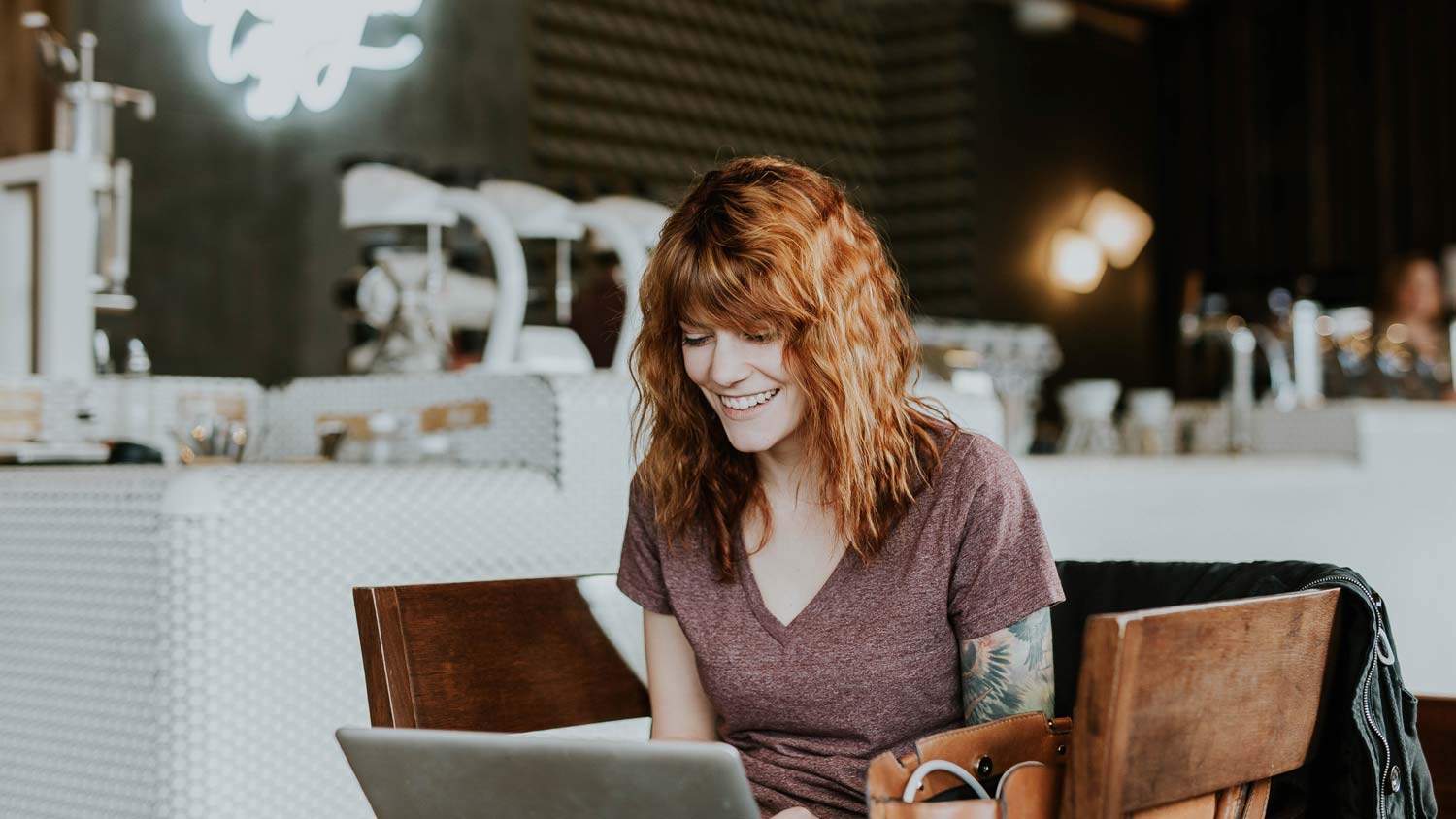 woman on laptop in cafe