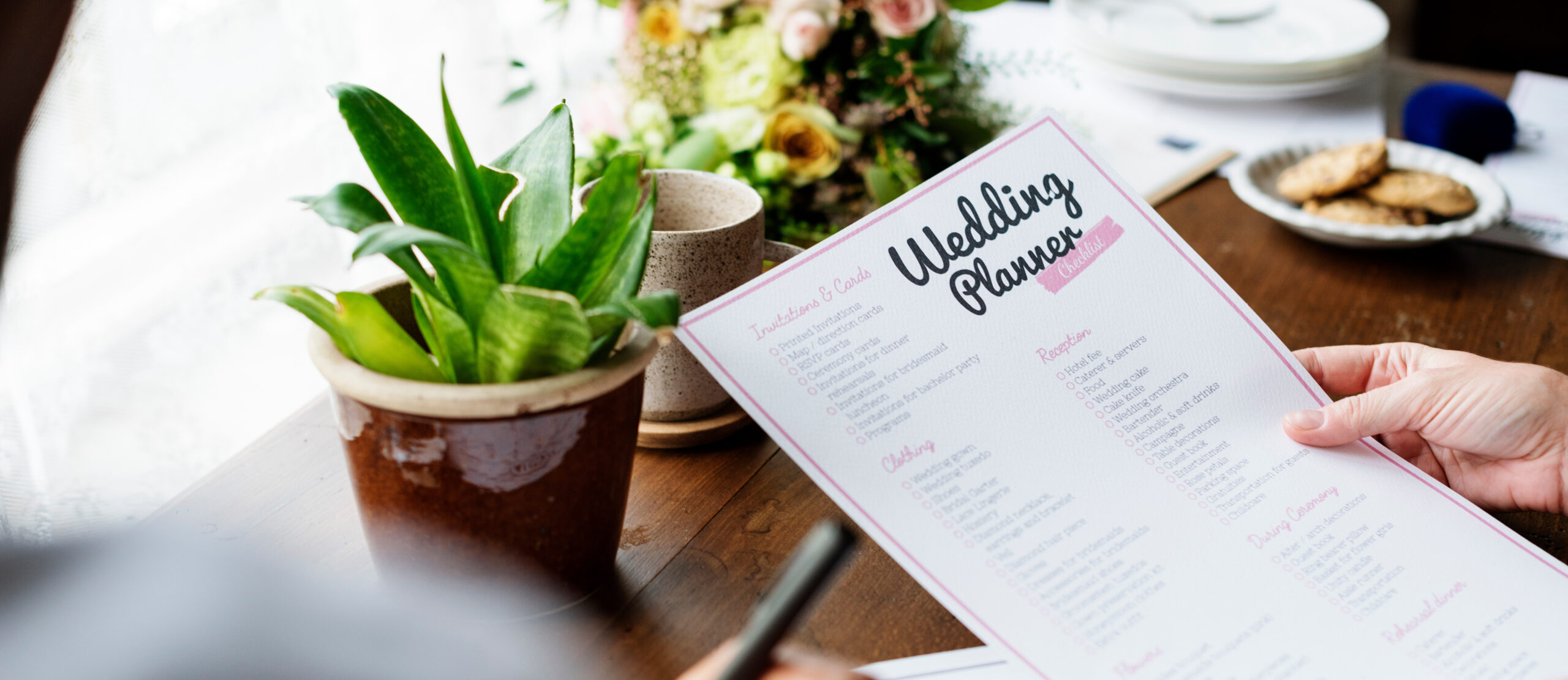 Hands Holding Wedding Planner Checklist Information Preparation